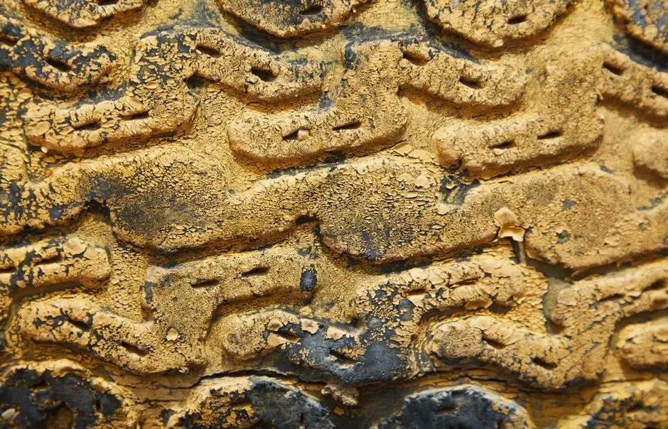 Top view of abstract background with rough surface of yellow aged tire of wheel