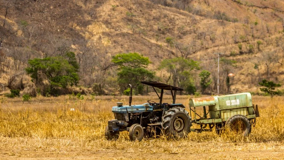 A tractor stands in a dry field in Cagua, Venezuela, capturing agricultural life