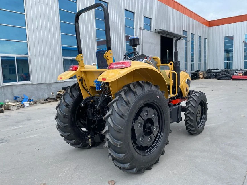 Yellow tractor parked outdoors near a modern industrial building with blue windows