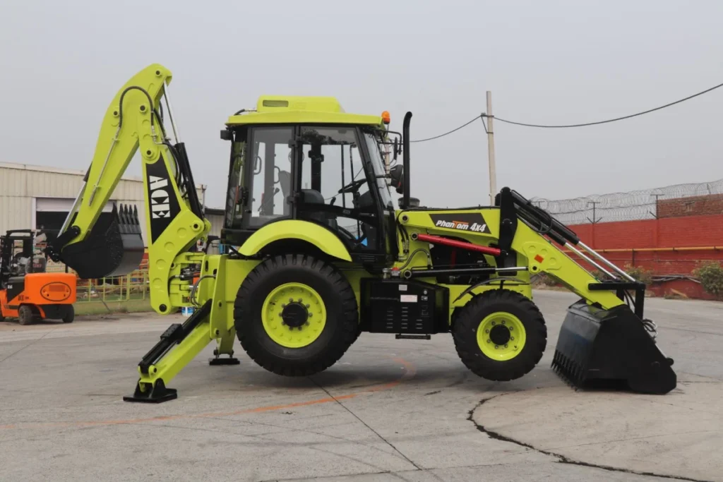 Tractor Tire Types Explained: R1 vs R2 vs R3 vs R4 Yellow backhoe loader parked on a construction site