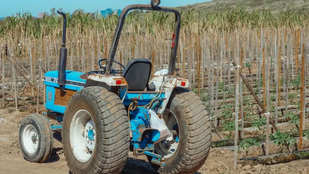 Tractor Tire Size Guide: How to Read Every Number on the Sidewall Blue compact tractor with small front and larger rear tires