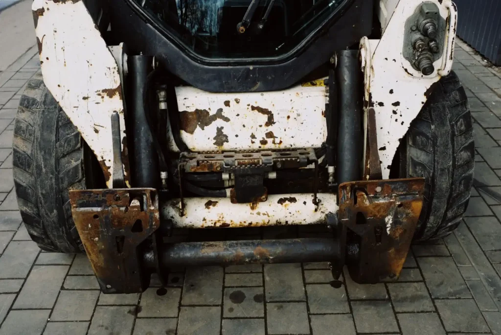 Close-up of the arm mounting on a small heavy duty loader frame