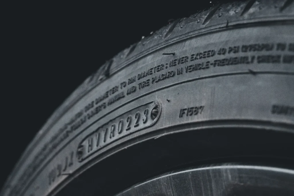 Tractor Tire Size Guide: How to Read Every Number on the Sidewall Close-up of molded lettering on a black tire sidewall