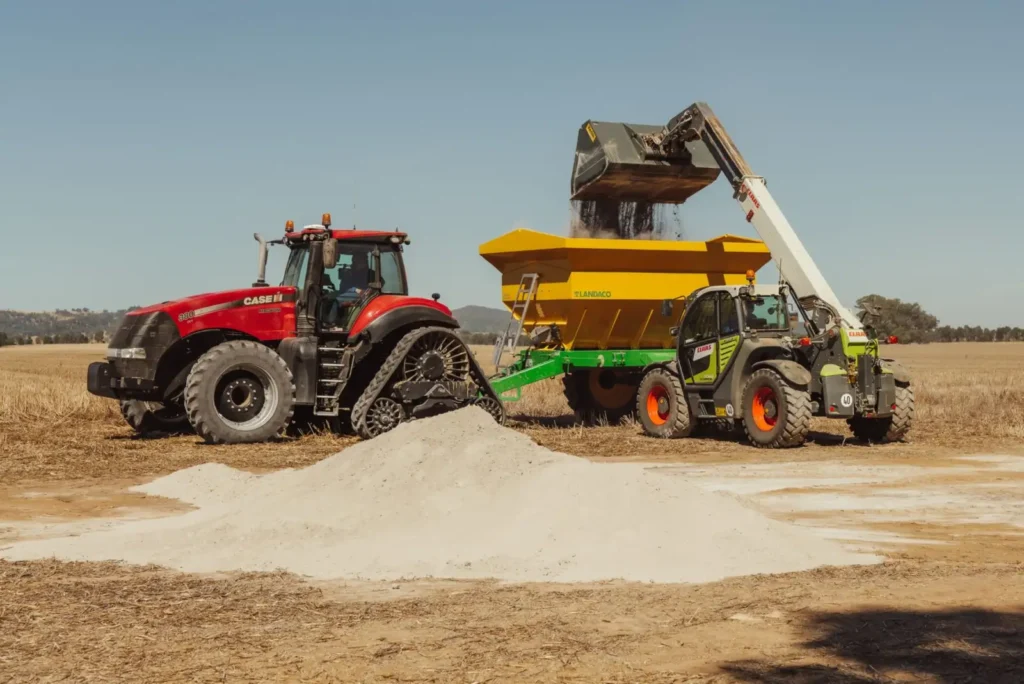 Tractor with a front loader working across a farm field