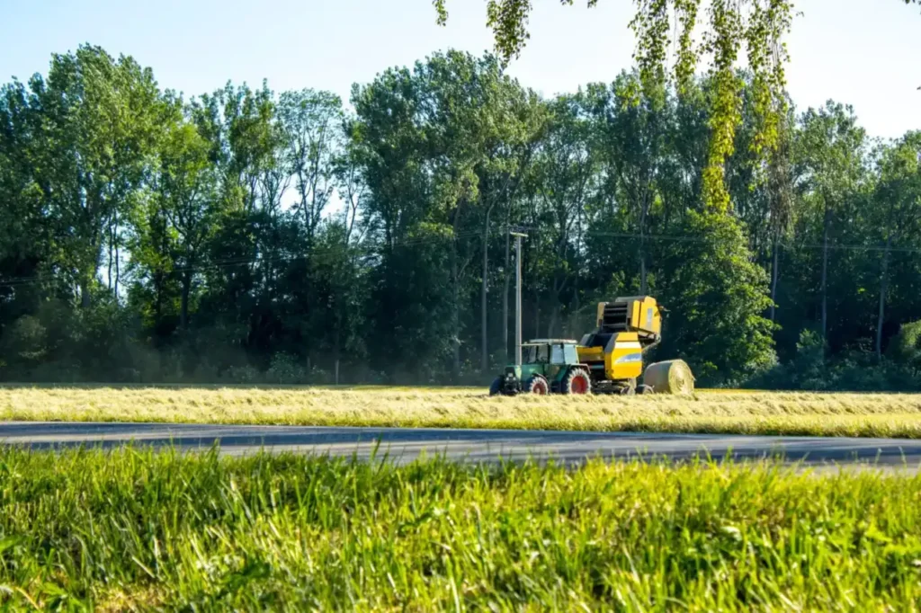 Tractor working in a lush green field in Germany